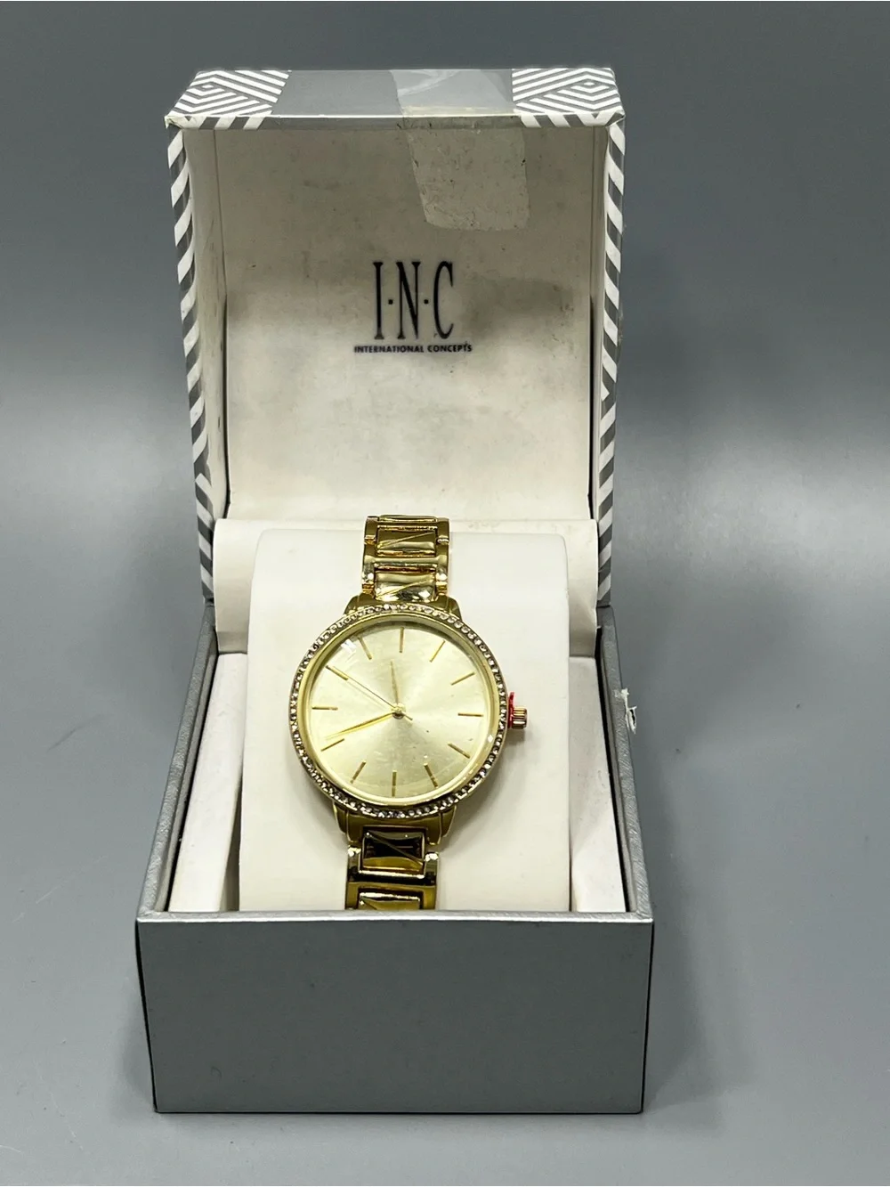 INC International Concepts sleek gold